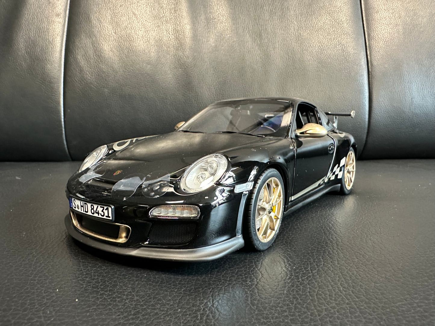 Porsche 911 GT3 RS black/gold 2009 1:18 Norev 187563 Порше 911 ГТ3 РС черен/златен