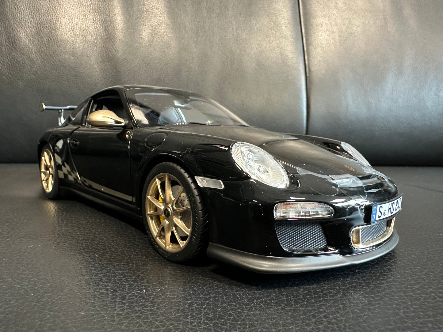 Porsche 911 GT3 RS black/gold 2009 1:18 Norev 187563 Порше 911 ГТ3 РС черен/златен