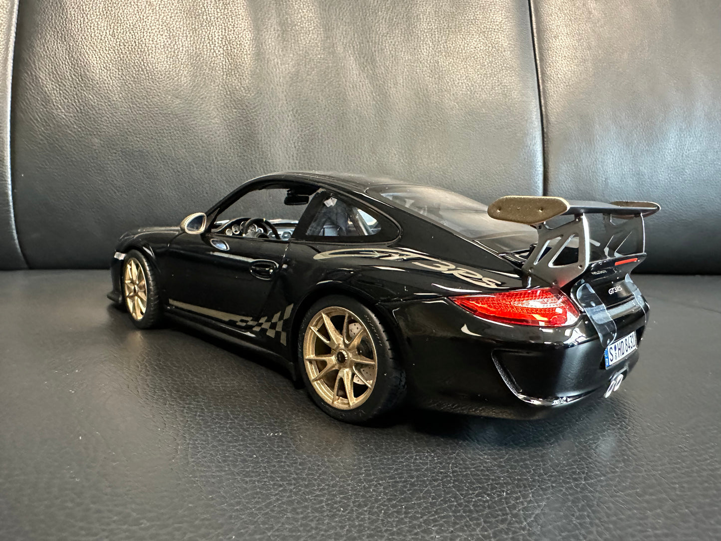 Porsche 911 GT3 RS black/gold 2009 1:18 Norev 187563 Порше 911 ГТ3 РС черен/златен